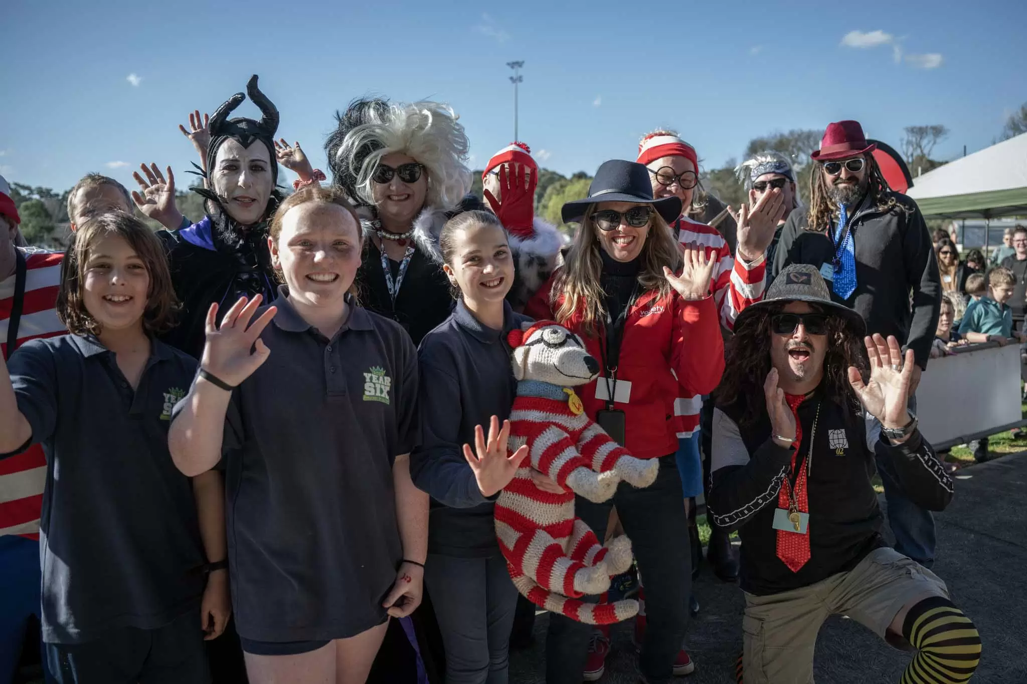 Crowd of Bash Participants dressed up and visiting a school